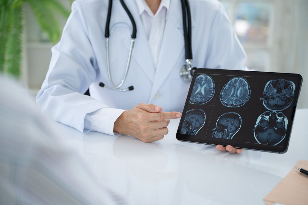 Neurologist Doctor treatment planning for diseases nervous system and brain with patient at Neurology Center.