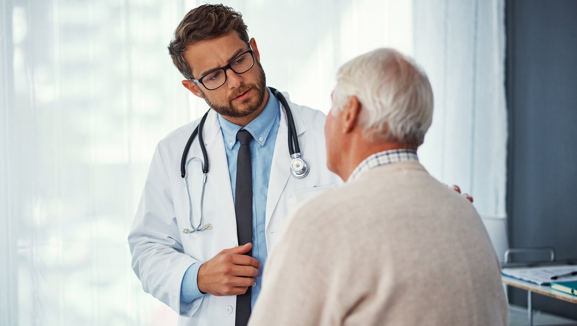 Shot of a doctor examining a senior patient in a clinic